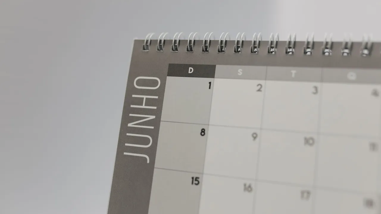 A desk calendar close-up with dates visible across the month
